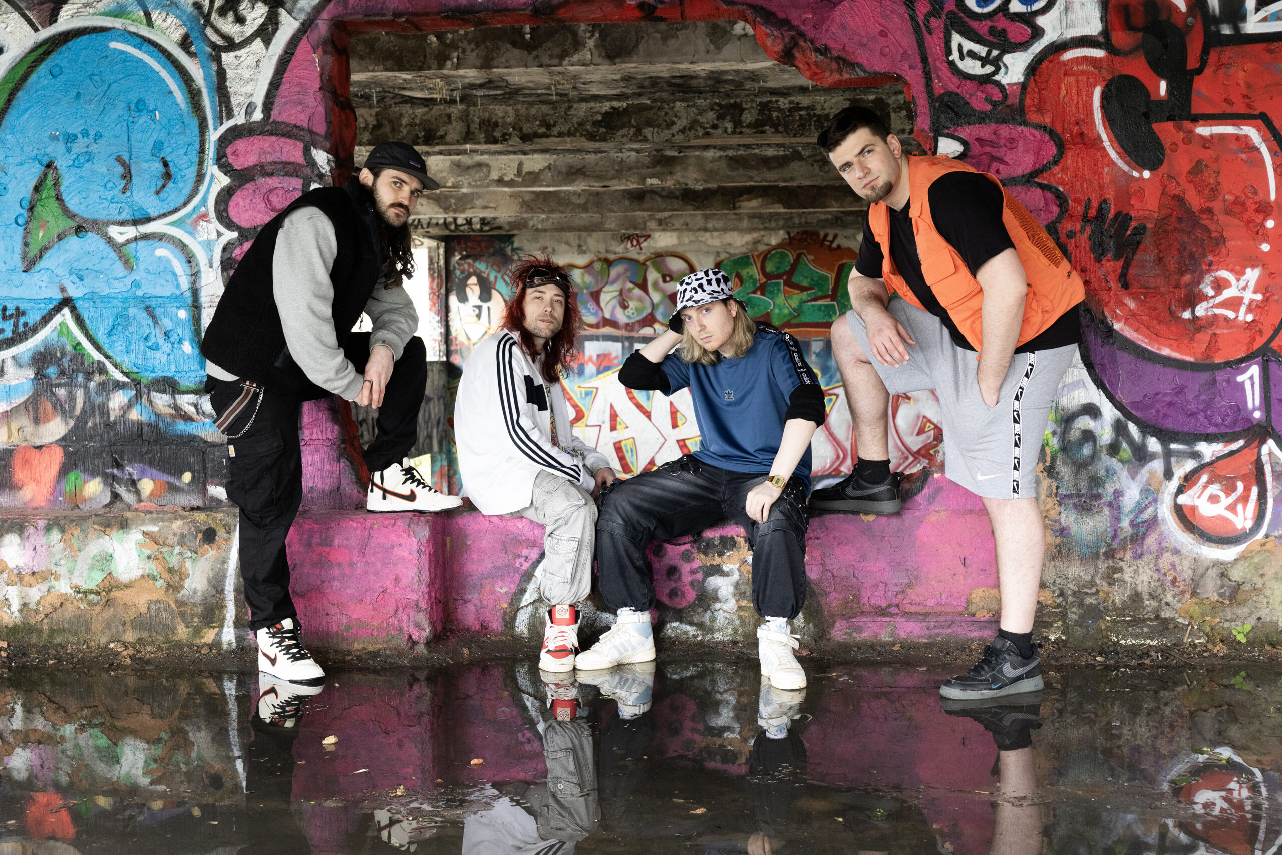 Velour Fog in a graffiti-covered tunnel